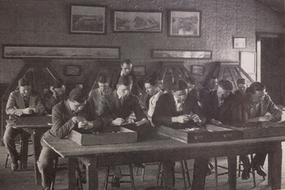 students study minerals in the Old Mining Building, circa 1920
