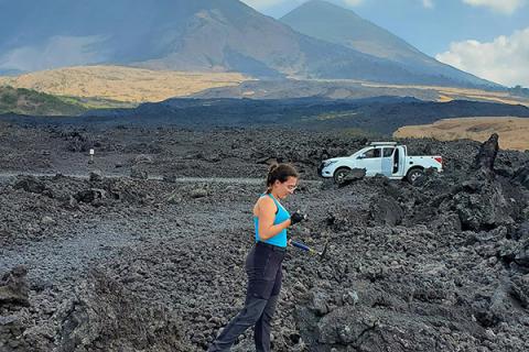 Judit Gonzalez-Santana, doctoral student in geosciences, sampling the May 2010 lava flow near Guatemala’s Pacaya volcano