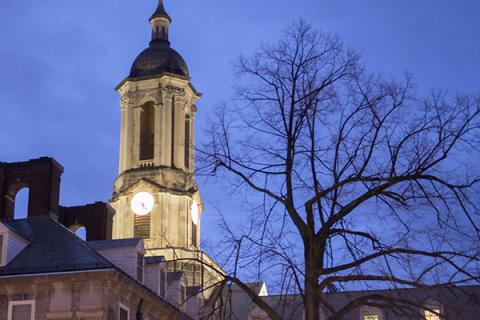Old Main at dusk on Penn State's University Park campus.