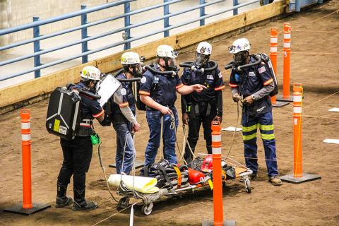 The Penn State Mount Nittany Mine Rescue Team works it way through the mock mine hazards at a mine rescue contest