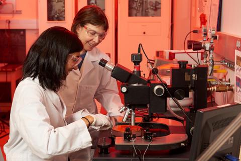 Right, Suzanne Mohney, professor of materials science and engineering, works with one of her students