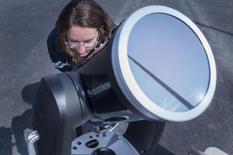 Chloe Stanton, a NASA PA Space Grant Fellow, has a look at the sun through a highly-filtered telescope