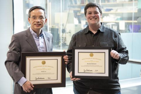 Zi-Kui Liu and Brandon Bocklund pose with their NASA Software of the Year awards 