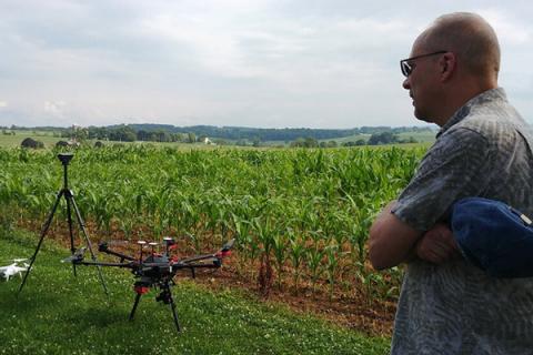 Douglas Miller examines drones used in his research