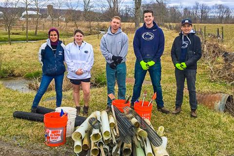 Positive Energy members help clean up a riparian buffer zone with ClearWater Conservancy.