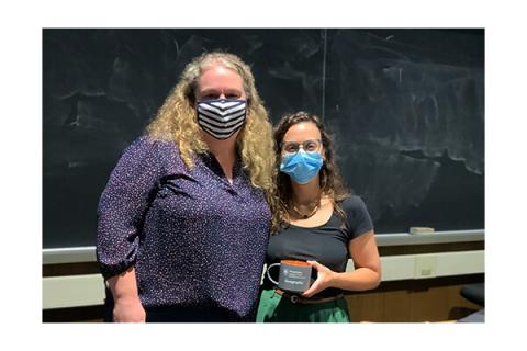 Louisa Holmes, assistant professor of geography, left, with speaker Heather Randell