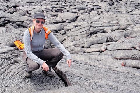 Christelle Wauthier, associate professor of geosciences, in Hawaii at an active lava flow on Kilauea volcano