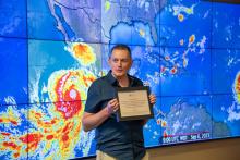 Chris Stachelski of the National Weather Service presents the award 