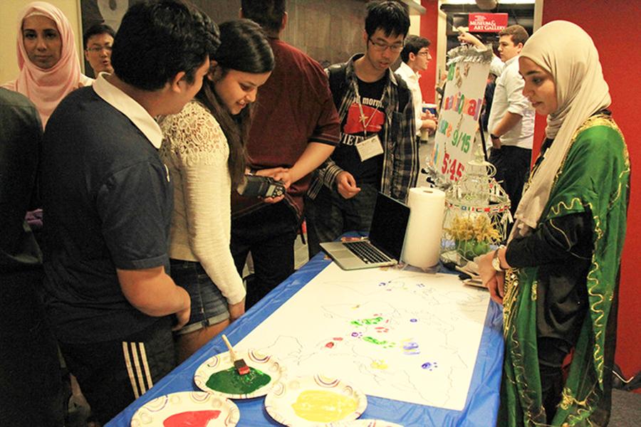 Students participated in a world map coloring activity during the first International Culture Night in 2015.