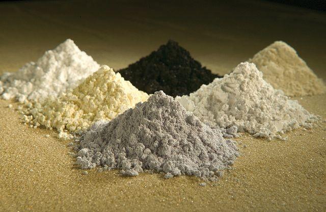 Rare-earth oxides, clockwise from top center: praseodymium, cerium, lanthanum, neodymium, samarium, and gadolinium.
