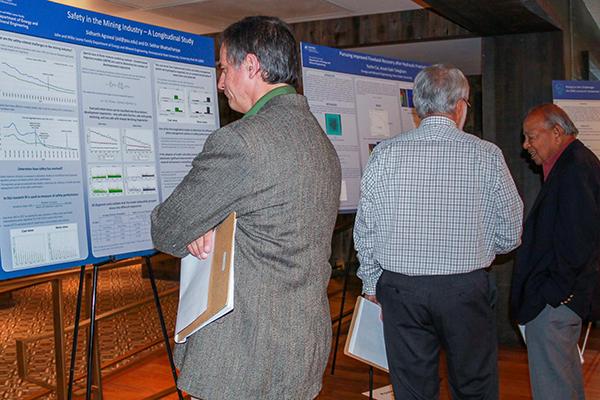 Attendees evaluate research posters at the 2019 EME Research Showcase