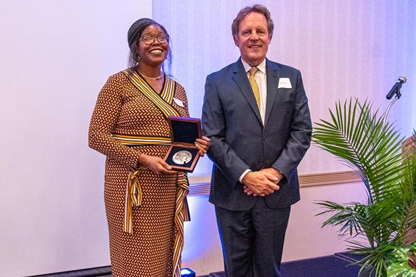 Tabbetha Dobbins accepts the  College of Earth and Mineral Sciences (EMS) Charles L. Hosler Alumni Scholar Medal 