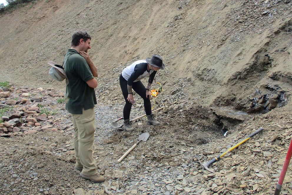 Julien Kimmig and Rhiannon LaVine investigate exposed Spence Shale sediments in Spence Gulch, Indiana