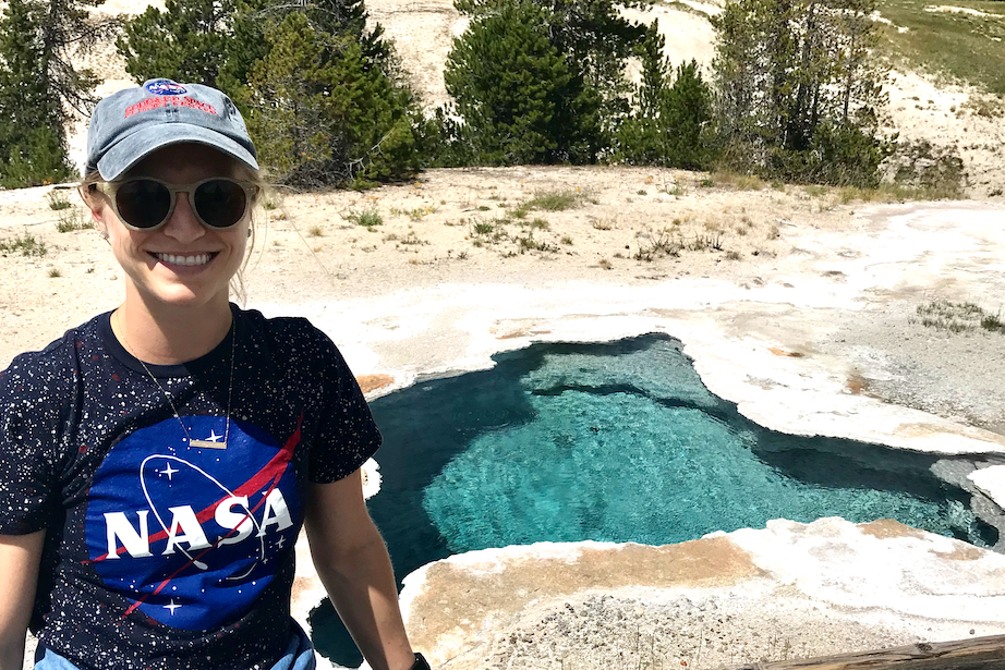 Penn State alum Rachel Kronyak poses next to a hot spring in Yellowstone National Park