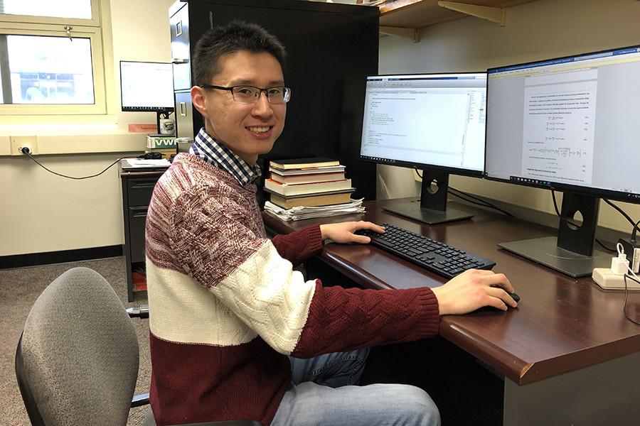 Wei Zhang coding for his research