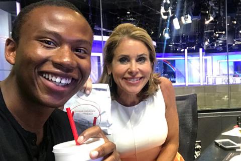 Meteorology intern Robert Johnson and his mentor Kathy Orr having lunch in the FOX 29 studio.
