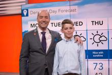 Cullen Slattery stands with one of his meteorology heroes, Bernie Rayno, a Penn State alumnus and chief video meteorologist