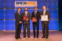Sami Alnuaim presents Michael Cronin, Hamid Emami-Meybodi and Russ Johns with awards