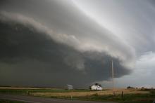 Storm clouds moving over farm fields 