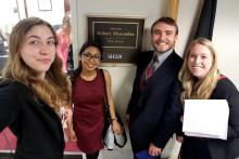 Tom Nigl, third from left, and fellow members of Penn State's Science Policy Society, speak with members of U.S. Congress