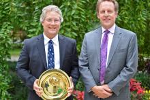 Rick Abegg, left, accepts the GEMS (Graduates of Earth and Mineral Sciences) Alumni Achievement Award from Lee Kump, dean of EMS