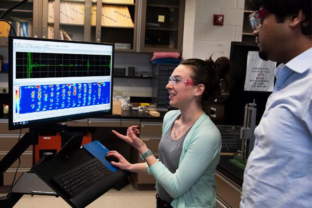 Researchers demonstrate the technology used to analyze wave propagation data.