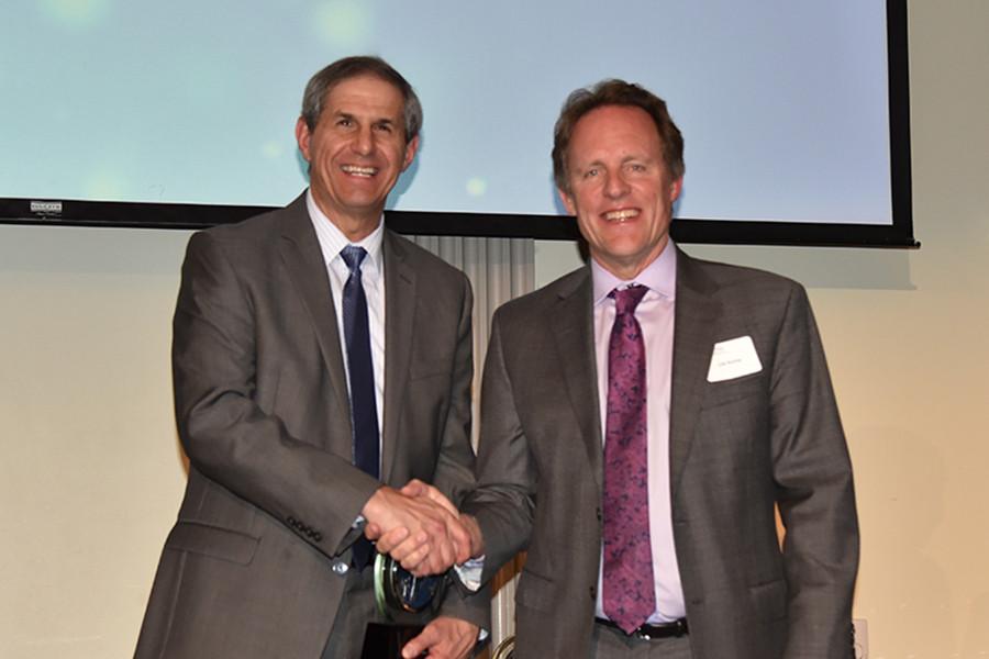 Jon Nese and Lee Kump, John Leone Dean in the College of Earth and Mineral Sciences, shake hands